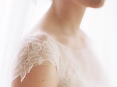 a woman wearing a white dress and veil