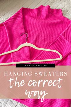 a pink sweater hanging on a hanger with the text hanging sweaters the correct way