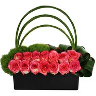 pink roses and green grass in a black box