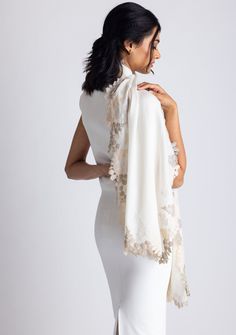 This classic ivory scarf is crafted from a luxurious blend of wool and silk, providing a soft and cozy feel. It features an exquisitely handcrafted triple-colored scalloped lace border in the perfect blend of earthy tones with an interplay between beige, natural, and alabaster. This versatile accessory is perfect for elevating any ensemble, making it a timeless must-have addition to any wardrobe, ideal for any occasion. Elegant White Pashmina Dupatta, Cream Pashmina Dupatta For Wedding, Elegant Silk Dupatta With Lace Work, Elegant Beige Silk Scarf, Elegant Cream Scarf For Formal Occasions, Elegant Beige Silk Scarf For Formal Occasions, Elegant Silk Scarves For Wedding, Elegant Cream Dupatta With Lace Work, Elegant Fitted Lace Shawl