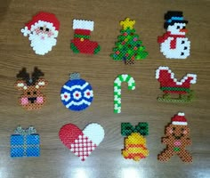 christmas ornaments made out of perler beads on a table