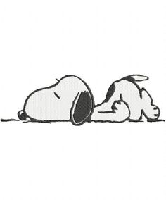 a snoopy dog laying down on the ground with his head up and eyes closed