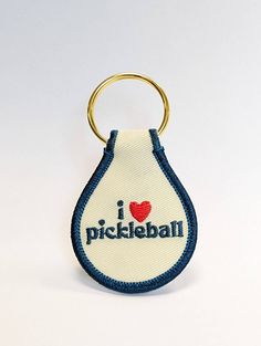 i love pickleball embroidered keychain in white and blue with red heart