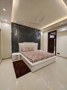 a bedroom with a bed, dressers and ceiling fan in it's center