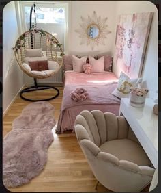 a bedroom with pink bedding and hanging chair in the corner next to a window