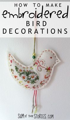 an embroidered bird ornament hanging on a wall with text overlay that reads how to make embroidered bird decorations