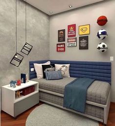 a bedroom with gray walls and blue bedding