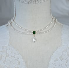 Vintage, Romantic Style Emerald Necklace, Wedding Pearl and Emerald CZ Bridal Choker, Green Emerald CZ Multi Row Vintage Pearl Necklace Materials used: - White/Ivory Cream Swarovski pearls - cubic zirconia stones - gold plated over brass The necklace will arrive packaged ready for gift giving in a delicate white jewelry box with a silver ribbon. Matching earrings for this necklace:  Back to my shop http://www.etsy.com/shop/crinadesign73 Thank you for visiting my store! Emerald Jewelry Vintage, Vintage Wedding Necklace, Emerald Jewelry Necklaces, Emerald Jewelry Necklace, Pearl Jewlery, Vintage Pearl Necklace, Ivory Necklace, Swarovski Pearl Necklace, Tiered Necklace