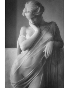 a black and white photo of a nude woman