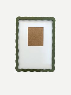 a square frame with a cork board in the middle