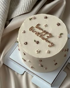 a white cake sitting on top of a table