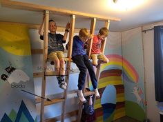 two children are sitting on the ladders in their room