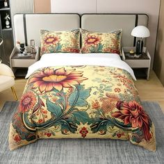 a bed with floral comforter and pillows in a bedroom