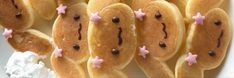 some very cute looking hot dogs with pink stars on them