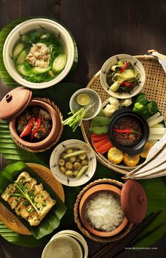 a table topped with bowls filled with different types of food