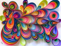 an art piece made out of colored paper