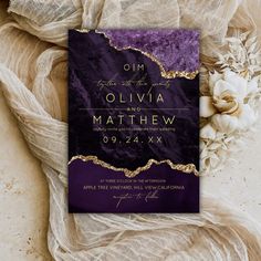 an elegant purple and gold wedding card