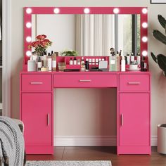 a bright pink vanity with lights on it