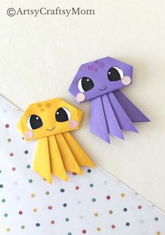 two origami squids sitting next to each other