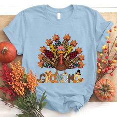 Personalized Grandma Grandkids Thanksgiving Turkey T-ShirtIf you looking for a personalized t-shirt to show your love to your family, it's will be best choice. Our Classic T-Shirt serves as the perfect short-sleeved shirt for your unique, funny, or personalized designs. Features such as a lay flat collar and a classic?ÿunisex cut will make this your new favorite t-shirt. Brand: Gildan Heavy weight fabric Classic unisex?ÿmakes this an easy fit Size up if you want something roomier Our shirts incl Leopard Print Background, Nana Shirts, Flat Collar, Personalized Grandma, Printed Backgrounds, Dark Grey Color, Personalized Clothes, Thanksgiving Shirts, Thanksgiving Turkey