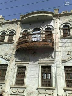 an old building with many windows and balconies