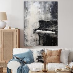 a living room filled with furniture and a painting hanging on the wall over a white couch