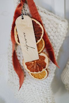 an orange cut in half with a tag attached to it