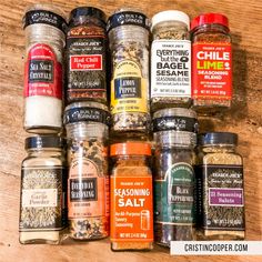 the spices are lined up on the table for sale in this photo, there is an assortment of seasonings and seasonings