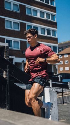 a man running up some stairs in the city