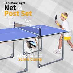 a young boy holding a tennis racquet on top of a ping pong table