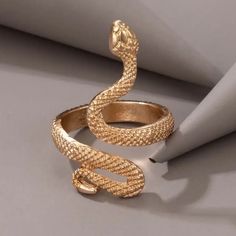 New Men's Adjustable Gold Snake Ring. Adjustable Size Range From 5 - 10. Made Of Copper With High Color Retention And Highly Polished. It Is Also Suitable For Women. You Can Wear It On Any Finger. Also Have Black, Black/Silver, Antique Silver, Vintage Gold, And Rose Gold In Separate Listings. Mens Gold Snake Ring, Adjustable Vintage Snake Ring For Gift, Luxury Vintage Hallmarked Snake Ring, Adjustable Gold Metal Snake Ring, Hermes Ring, American Flag Pin, Shoe Pendant, Antique Gold Snake-shaped Jewelry, Gold Cuban Link Chain