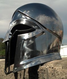 a close up of a helmet on a rock