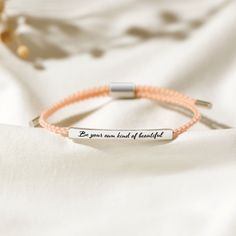 DESCRIPTIONEmbrace the power of self-love and individuality with this elegant motivational bracelet, delicately engraved with the uplifting phrase: "Be your own kind of beautiful". Crafted with intention and care, this piece serves as a constant reminder to celebrate your unique beauty, unswayed by the world's expectations. The simple yet profound engraving encourages a journey of self-acceptance and resilience, making it a perfect accessory to wear with pride every day. Whether it's a token of Let Them Talk, Motivational Bracelets, Uplifting Phrases, Tube Bracelet, Rare Gifts, Be Your Own Kind Of Beautiful, Halloween Sale, Premium Gift, Gift Packs