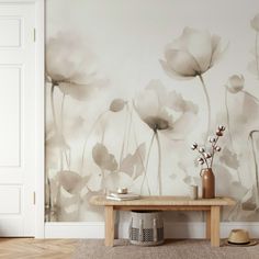 a room with a table and flowers on the wall