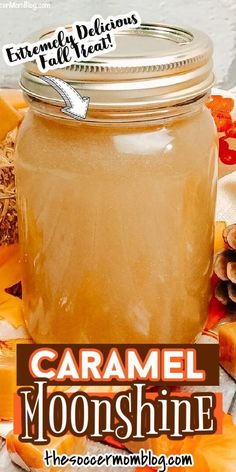 a jar filled with caramel moonhine sitting on top of a table