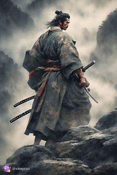 a man with two swords standing on top of a rock in the foggy sky