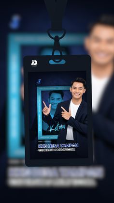 a man holding up a card with an image of him in the center and another person behind it