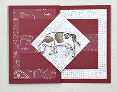 a card with an image of a cow on the front, and a red background