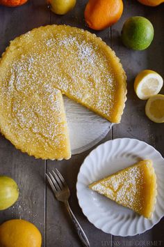 a lemon tart with one slice cut out