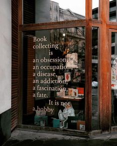 a book store window with an advertisement on it's glass and the words, book collecting is an occasion