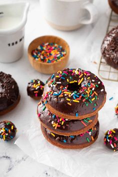 chocolate donuts with sprinkles and coffee cup on the side, ready to be eaten