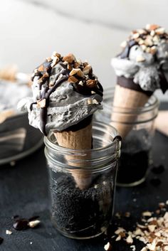 two ice cream sundaes with nuts on top