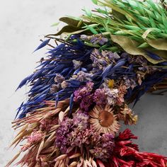 a bunch of dried flowers laying on top of each other