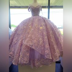 This Dress Is Lilac Color, Can Be Strap Or Strapless, Has Flowers Design, Mini Tail On The Back, And Sparkly On Top. Light Purple With Gold Quinceanera Dresses, Rapunzel Sweet 16 Dress, Rapunzel Quinceanera, Purple Quince Dress, Lavender Quince Dresses, Quince Court, Lavender Quinceanera Dresses, Lavender Quinceanera, Lavender Quince