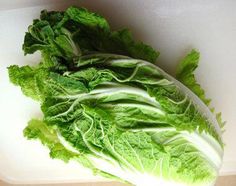 lettuce on a cutting board ready to be cut