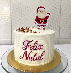 there is a cake that says feliz natal on the top and santa clause on the bottom