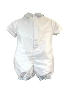 Sophisticated Shantung Fabric: Crafted from high-quality shantung fabric, this romper exudes sophistication and elegance, ensuring your child looks charming and stylish. Blue Detailing: The blue accents add a touch of color and charm to the romper, creating a beautiful contrast against the shantung fabric. Short Sleeve Design: The short sleeves provide a comfortable fit and allow for easy movement, making it ideal for active toddlers. Matching Barret: Complete the look with the matching barret, adding an extra touch of style and elegance to your little one's outfit. Versatile Style: Whether it's a christening, wedding, or any special event, this romper is versatile enough to suit various occasions, making it a timeless addition to your child's wardrobe. Attention to Detail: Meticulously cr White Fitted Satin Sets, Short Sleeve Design, Blue Accents, Sleeve Designs, Versatile Style, Special Event, Comfort Fit, Rompers, Short Sleeves