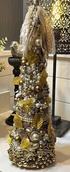 a christmas tree made out of gold and silver ornaments