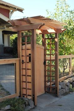 a wooden structure with an open door on the side