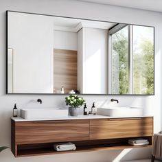 a bathroom with two sinks and a large mirror on the wall above it is shown